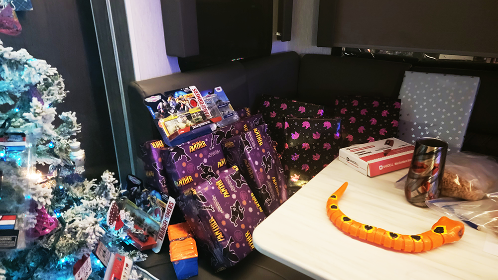 RV Christmas celebration with tree and gifts